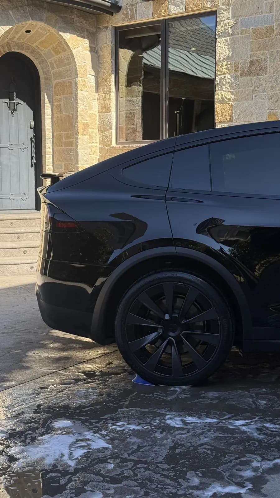 Black Tesla photographed by JX Auto Lab