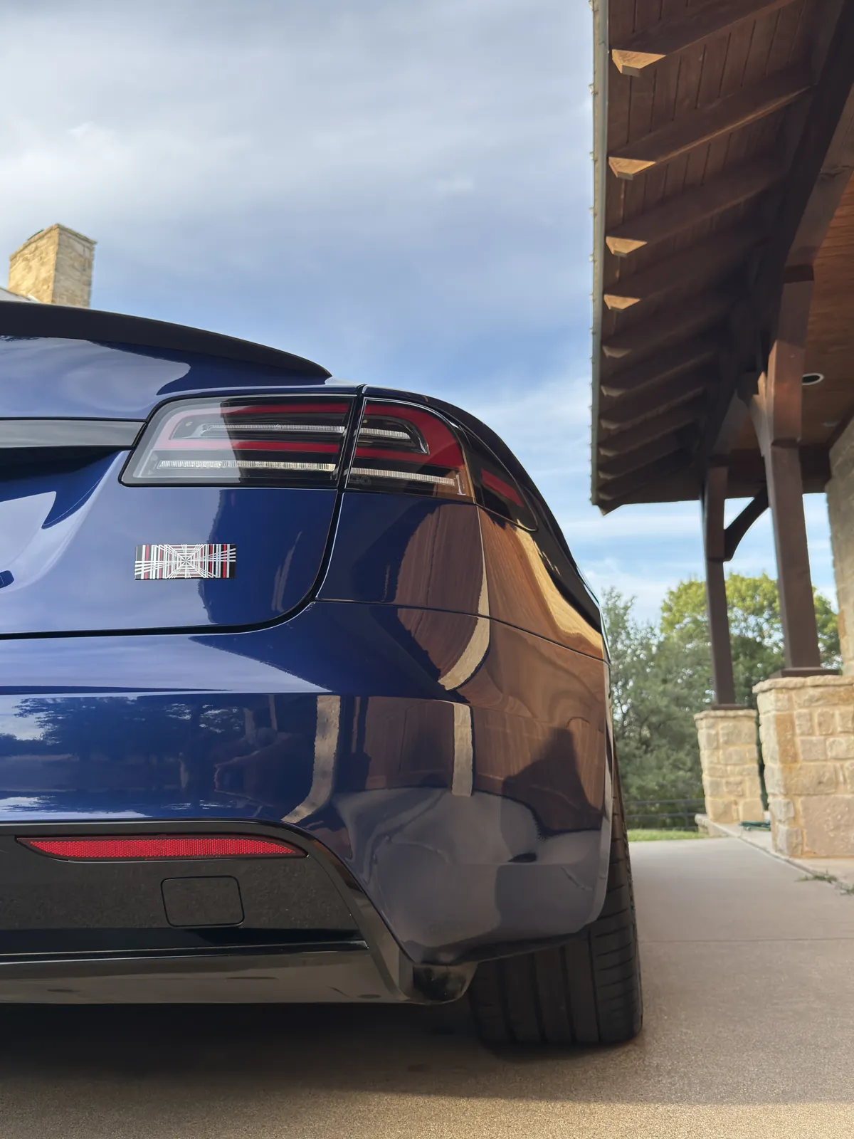 Blue Tesla photographed by JX Auto Lab