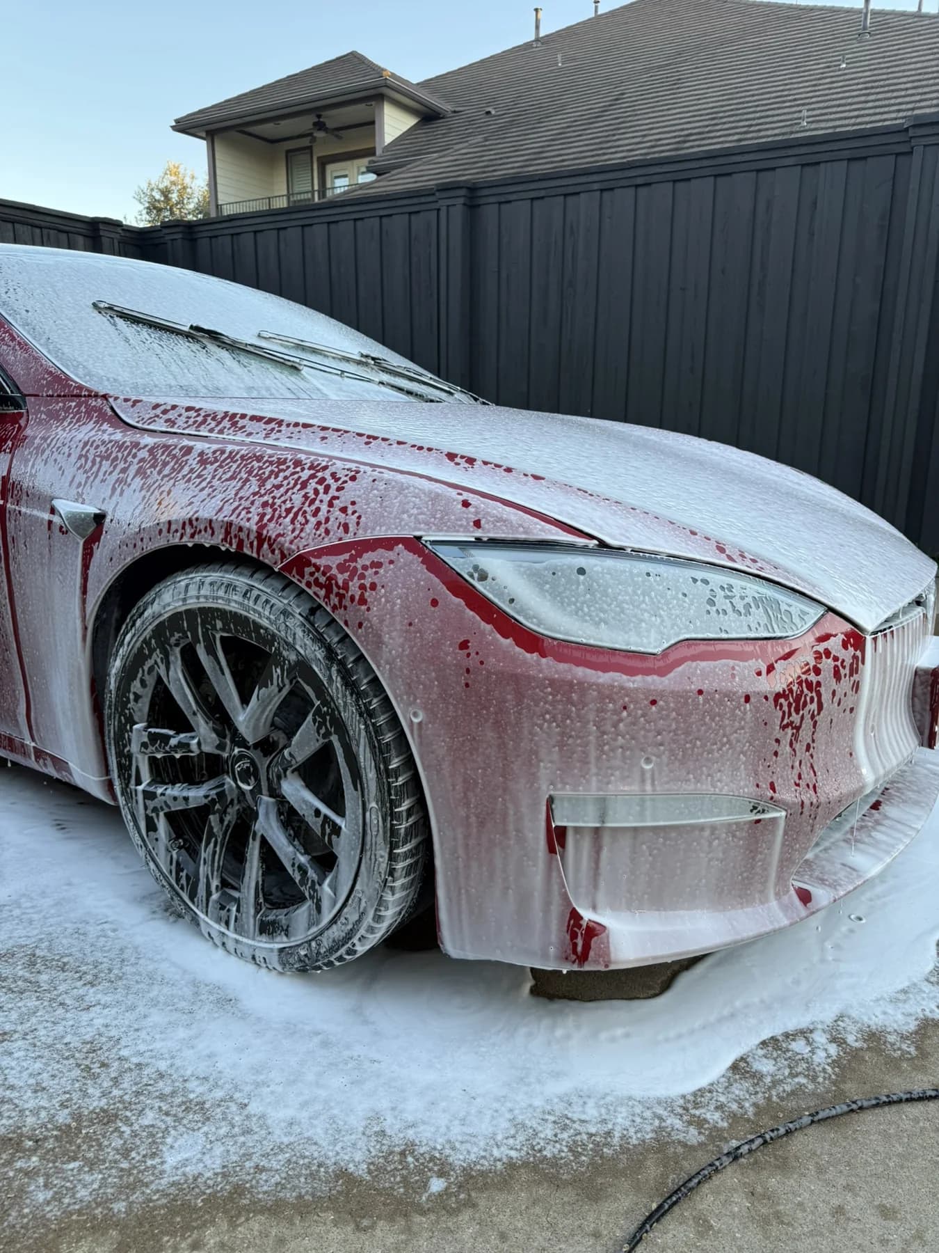 BMW covered in foam during a JX Auto Lab wash