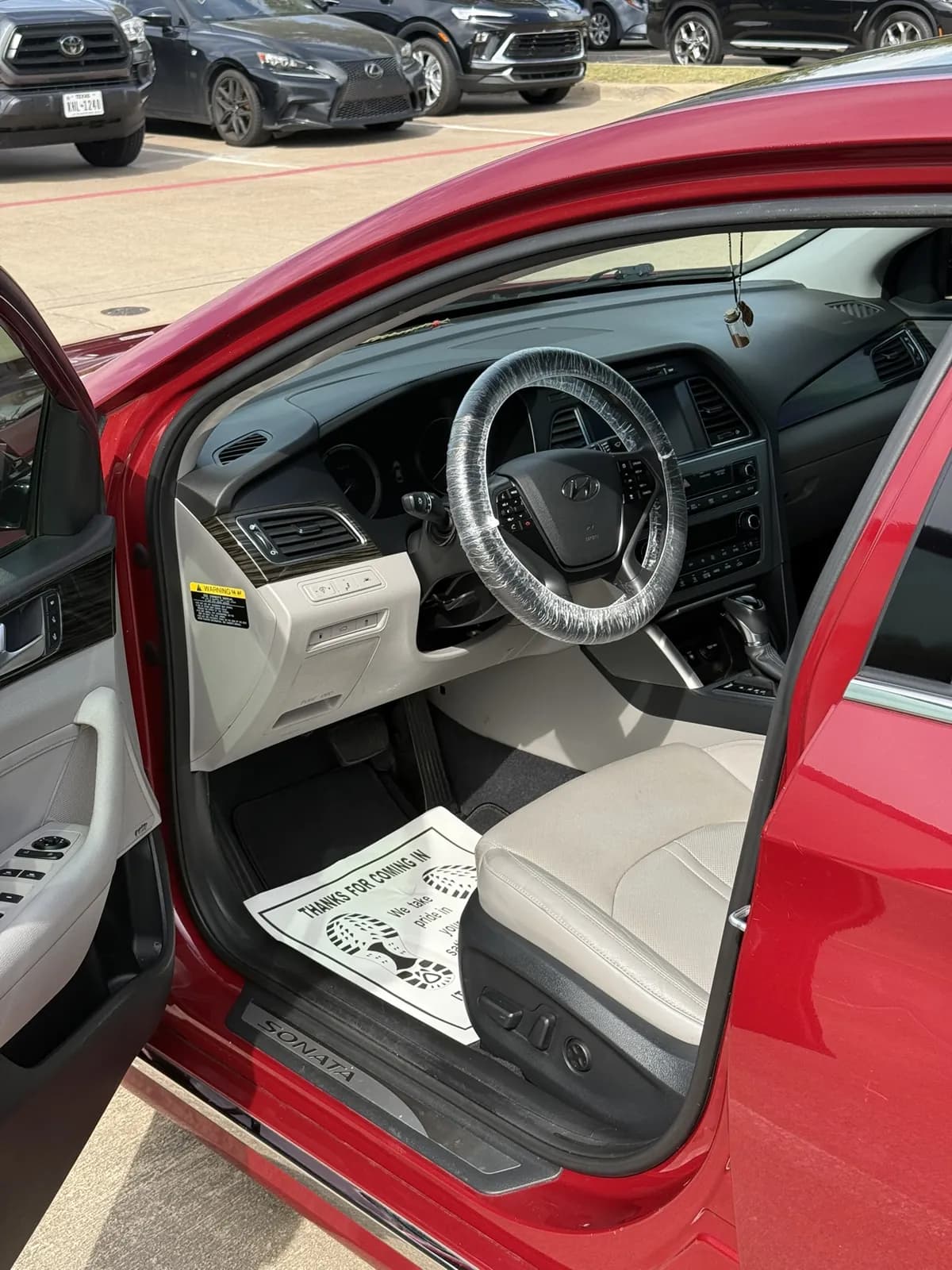 Red sedan cabin photographed by JX Auto Lab
