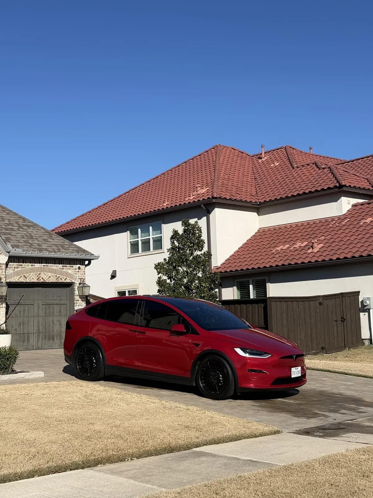 Red Tesla photographed by JX Auto Lab