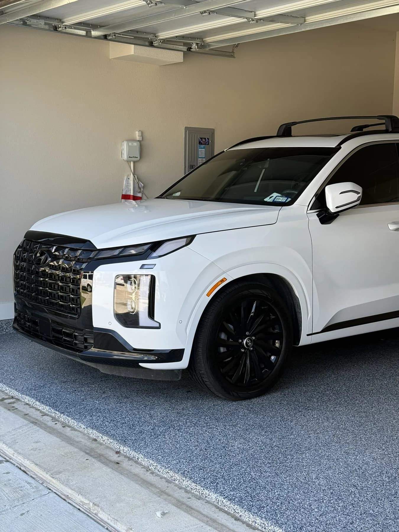 White SUV photographed at a JX Auto Lab detail
